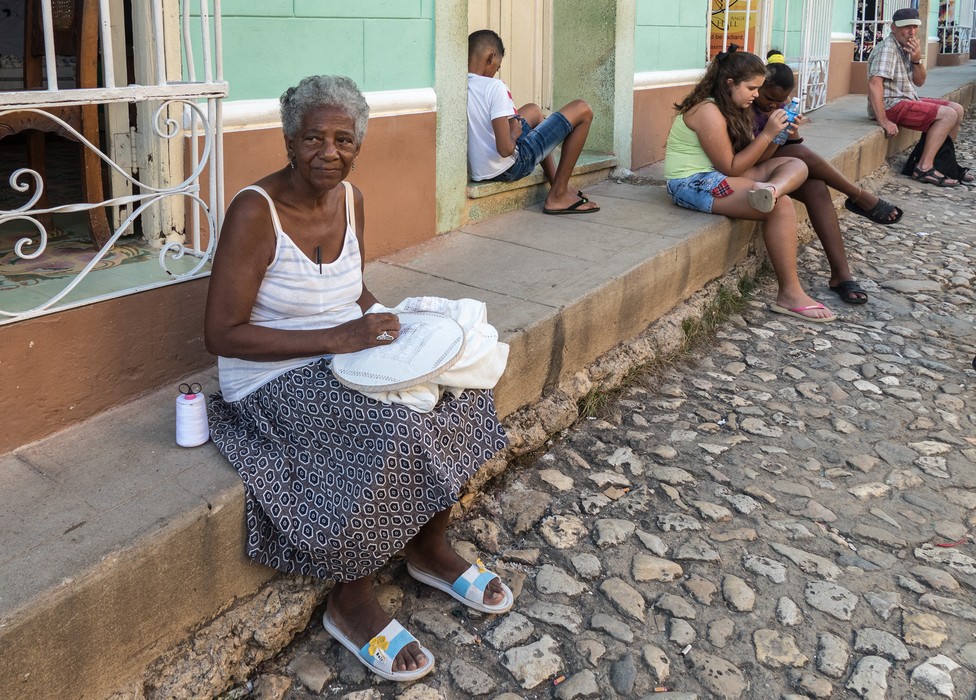 Woman embroidering.<br />Nov. 5, 2016 - Trinidad, Cuba.