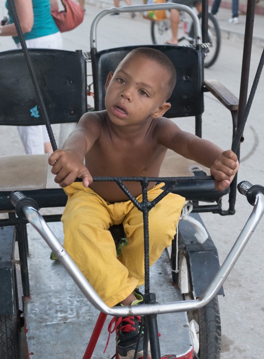A child on a pedicab.<br />Nov. 5, 2016 - Trinidad, Cuba.