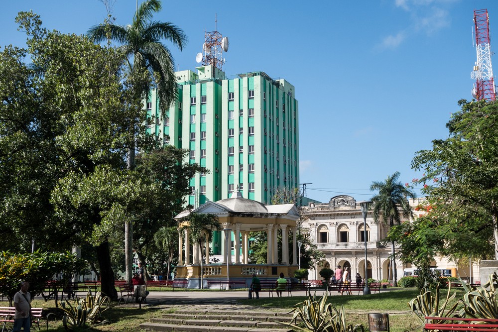 Osmar asks: was this building built before or after the revolution? It was build before, hence all the bullet holes (need to enlarge photo to see them).<br />Nov. 7, 2016 - Parque Vidal, Santa Clara, Cuba