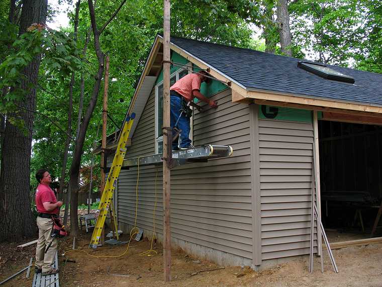 May 20, 2008 - Merrimac, Massachusetts.<br />Brian cuts the siding and Paul puts it up.
