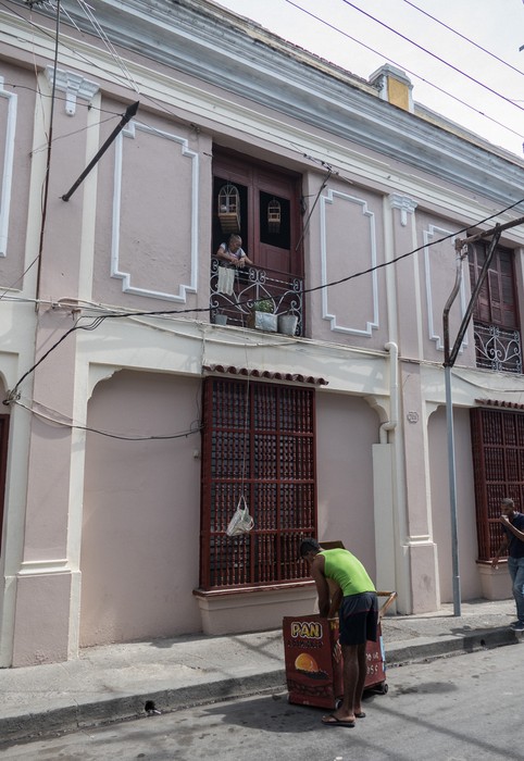 Old woman buying bread.<br />Oct 30, 2016 - Santiago de Cuba.