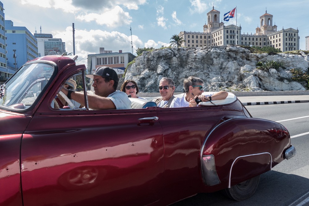 Terry, Bill, and Judy in the back seat with our Hotel National in the background.<br />Our ride in American vintage cars.<br />Nov. 10, 2016 - Havana, Cuba.