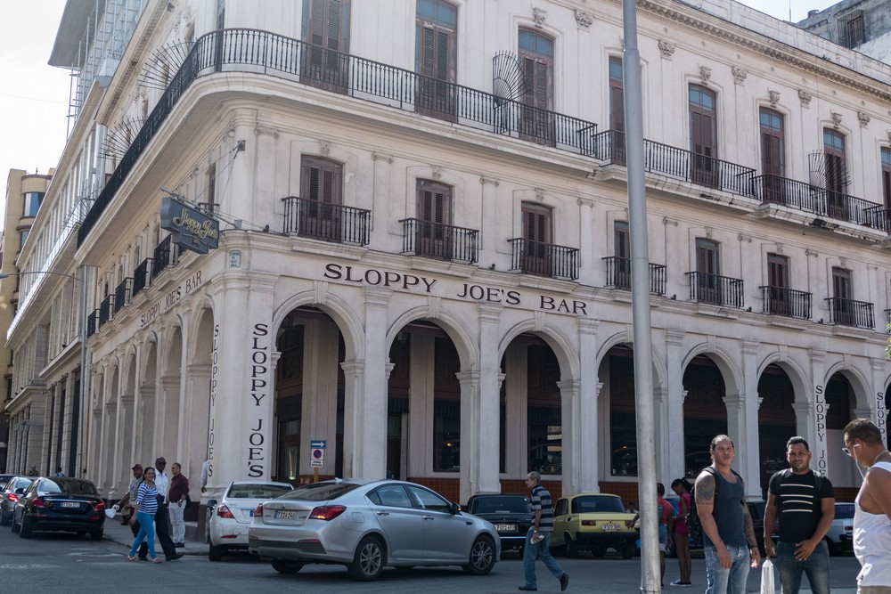 Riding by the Sloppy Joe's Bar.<br />Our ride in American vintage cars.<br />Nov. 10, 2016 - Havana, Cuba.
